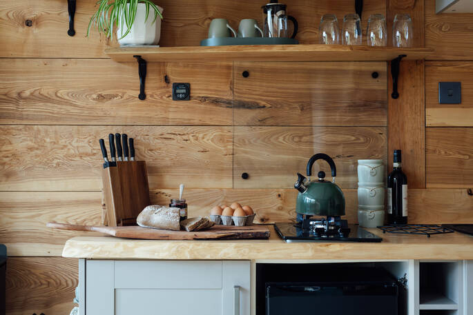 Kitchen equipped with a two ring gas stove and undercounter fridge
