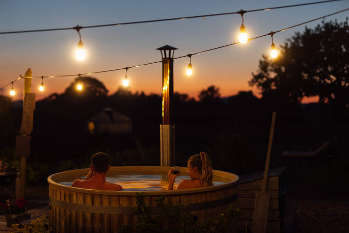 Box Barn camp hot tub at night, Raglan, Monmouthshire - Owen Howells Photography