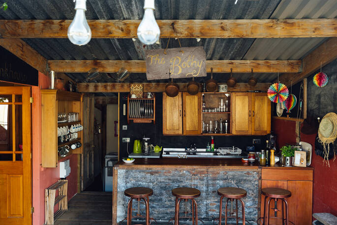 Outdoor bar with an undercounter fridge and utensils