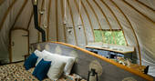 Comfortable kingsize bed inside Catta Dee tent at Penhein Glamping in Monmouthshire
