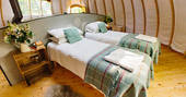 Twin beds inside The Coombe tent at Penhein, that can be pushed together to make a kingsize