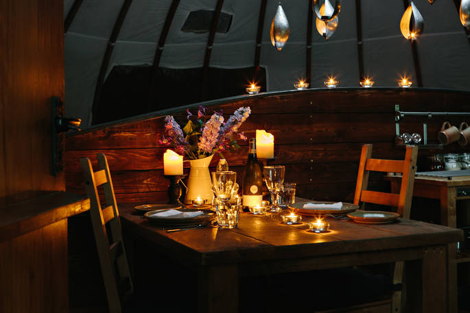 Enjoy a romantic candlelit dinner at The Coombe tent at Penhein Glamping in Monmouthshire