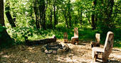Chairs around the firepit at Penhein Glamping in Monmouthshire