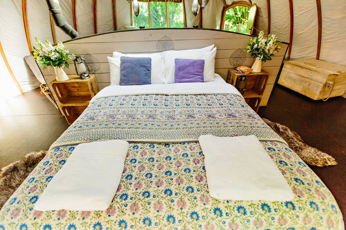 The comfortable kingsize bed at the Oakes at Penhein Glamping