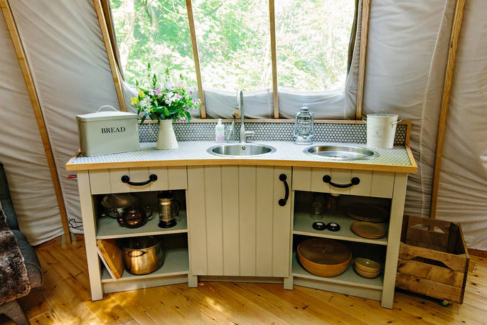 The fully-equipped kitchen area inside The Oakes tent at Penhein Glamping in Monmouthshire