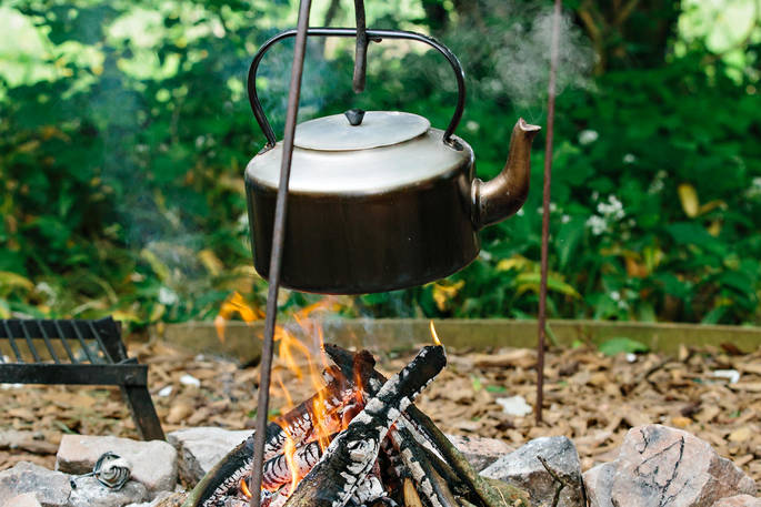 Kettle boiling on the campfire at Penhein Glamping in Monmouthshire