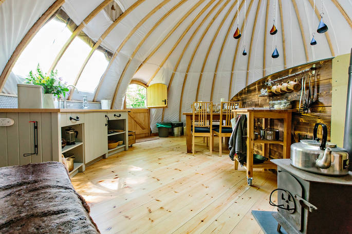 The fully-equipped kitchen and dining area at The Park tent, Penhein Glamping in Monmouthshire