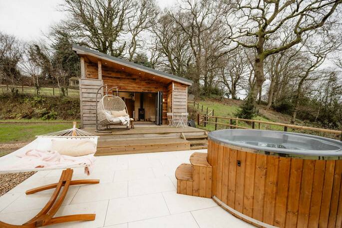 Front exterior with wood fired hot tub