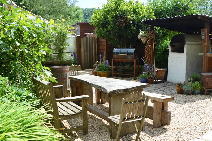 Brambling Cross cabin courtyard dining area, The Hop Garden at Kingstone Brewery, Tintern, Monmouthshire, Wales