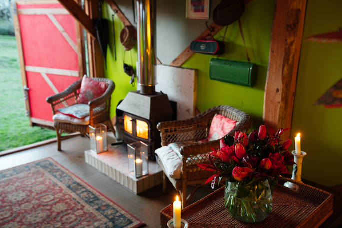 A roaring log burner, the perfect cosy spot at Stripy Bothy, Monmouthsire in Wales