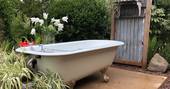 Woodlands Farm glamping outdoors bathtub, Monmouthshire, Wales