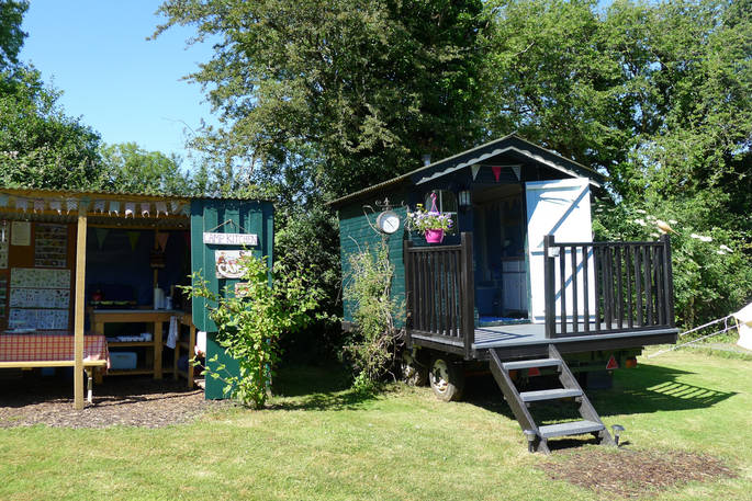 The outdoor kitchen and bathroom hut onsite at Cwt Gwyrdd in Pembrokeshire, Wales