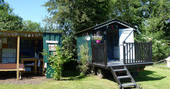 The outdoor kitchen and bathroom hut onsite at Cwt Gwyrdd in Pembrokeshire, Wales