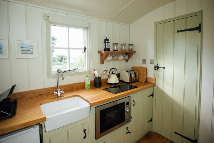 shepherd's hut fitted kitchen with belfast sink