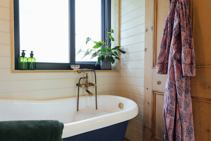 Bath tub downstairs next to the bathroom