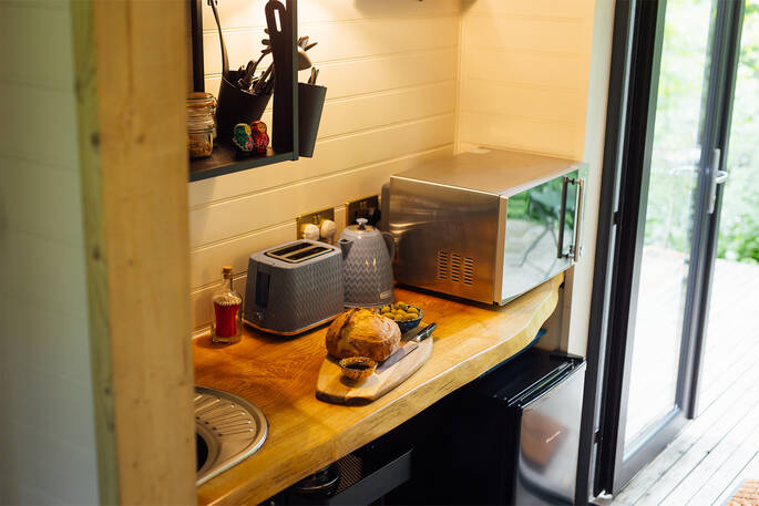 Kitchenette has an undercounter fridge