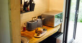 Kitchenette has an undercounter fridge