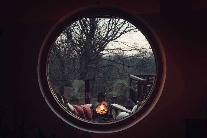 The Forager's Cabin - view from the living room to the firepit/BBQ, Bed in Branches, Moel Y Garth, Welshpool, Powys, Wales - Owen Howells Photography