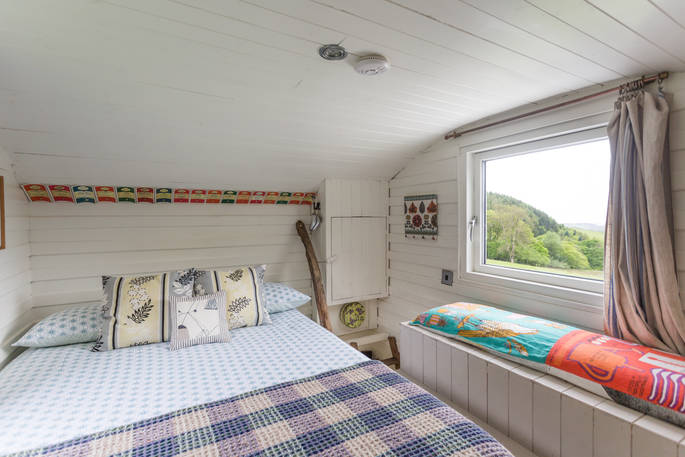 Cabin bedroom with countryside views