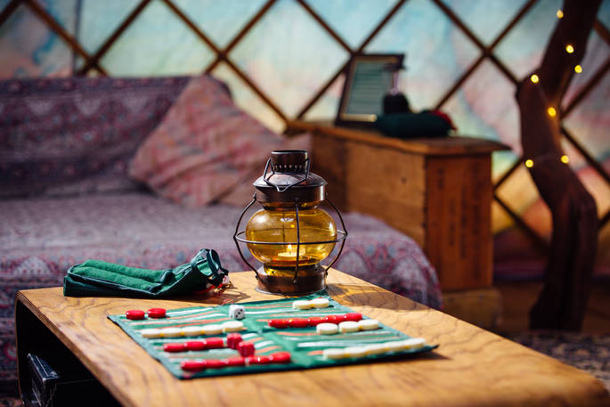 A game at the table in Jericho Yurt, Powys in Wales.