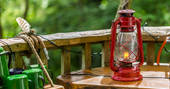 Hurricane lamp and outdoor kitchen at Old Larch Yurt in Wales