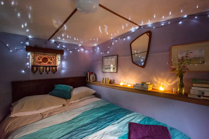 Double bedroom in Van Goff cosy cabin in Powys, Wales with fairy lights