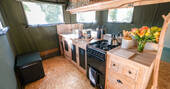 Kitchen equipped with an oven, hob, kettle and all cooking utensils