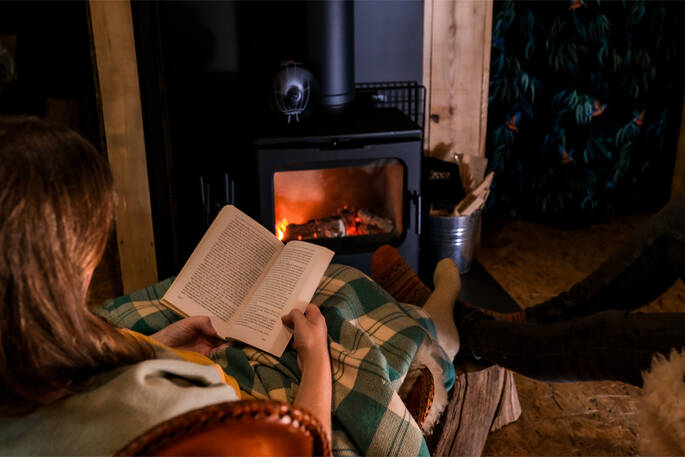 Read a book by the wood burner