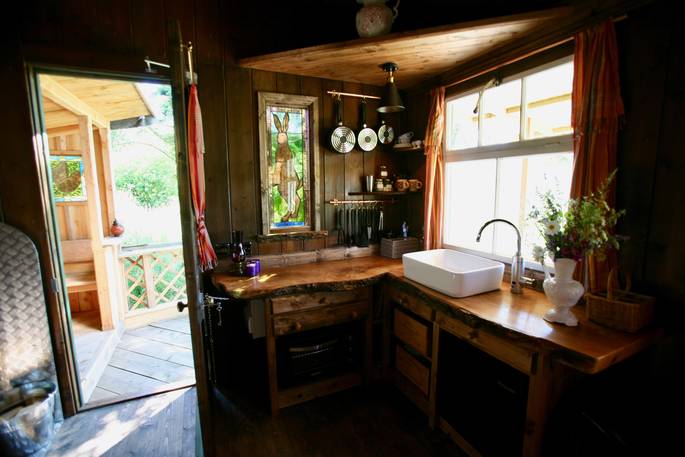 Fully equipped kitchen inside of The Duck Hut cabin in Powys