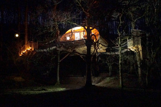 Living room treehouse at night time at Powys in Wales 