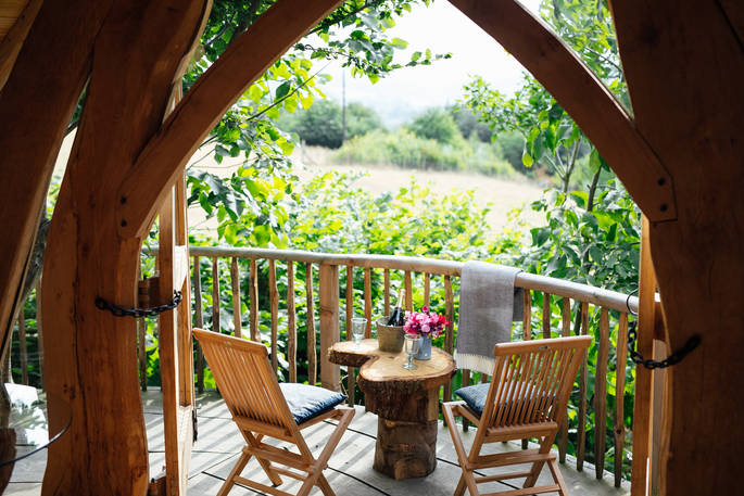 Enjoy beautiful countryside views from the decking outside Dragon Cruck cabin at Sunnylea