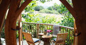 Enjoy beautiful countryside views from the decking outside Dragon Cruck cabin at Sunnylea