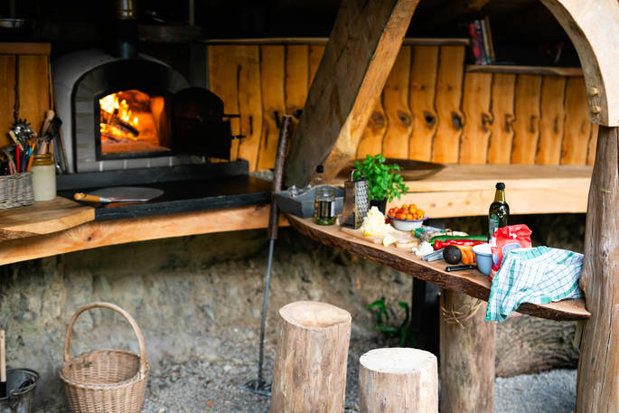 Cook up a feast in the fully-equipped outdoor kitchen at Dragon Cruck, and dine al fresco as you watch the sunset over the Powys countryside