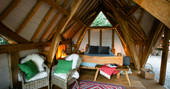 Cosy and rustic interiors at Dragon Cruck, Sunnylea in Powys