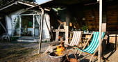 Relax on the deckchairs and keep cosy by the firebowl outside The Sleepout at Sunnylea