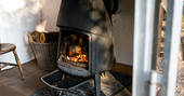 Cuddle up next to the cosy log burner at The Sleepout, Sunnylea