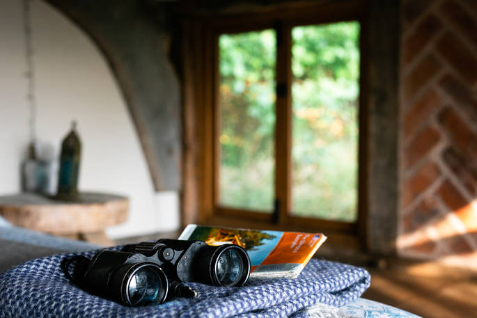 Binoculars and travel book at The Sleepout, Sunnylea