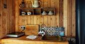 Kitchen equipped with a hob and cool box