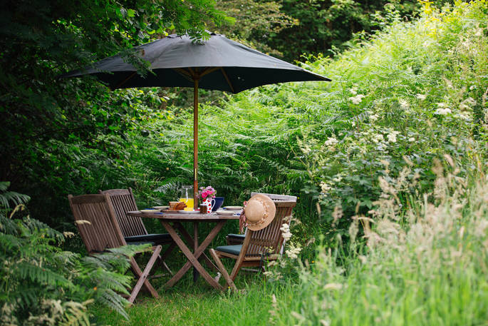 Dine outside come rain or shine and feel surrounded by nature at The Straw Cottage in Powys, Wales