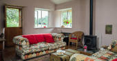 The bright and colourful living space at the Straw Cottage in Powys, where you can leave the windows open and let the fresh air blow in