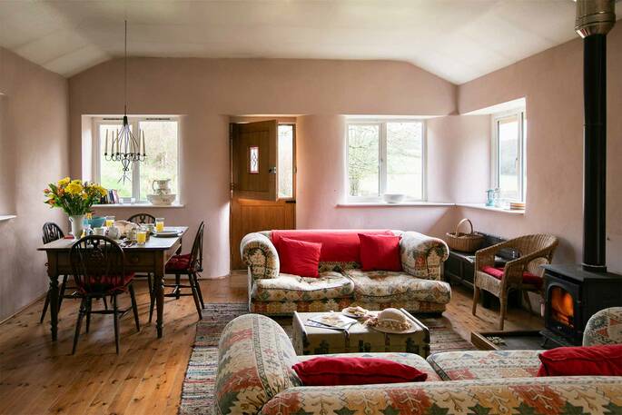 The bright and colourful living space at the Straw Cottage in Powys, where you can leave the windows open and let the fresh air blow in