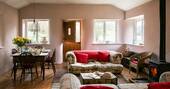 The bright and colourful living space at the Straw Cottage in Powys, where you can leave the windows open and let the fresh air blow in