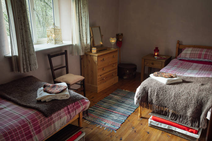 The cosy bedroom, perfect for a family at The Straw Cottage in Powys, Wales