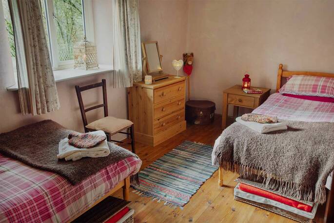 The cosy bedroom, perfect for a family at The Straw Cottage in Powys, Wales