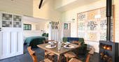 Sit down and enjoy breakfast the roaring fire inside Walden Lodge at Hide at St Donats 