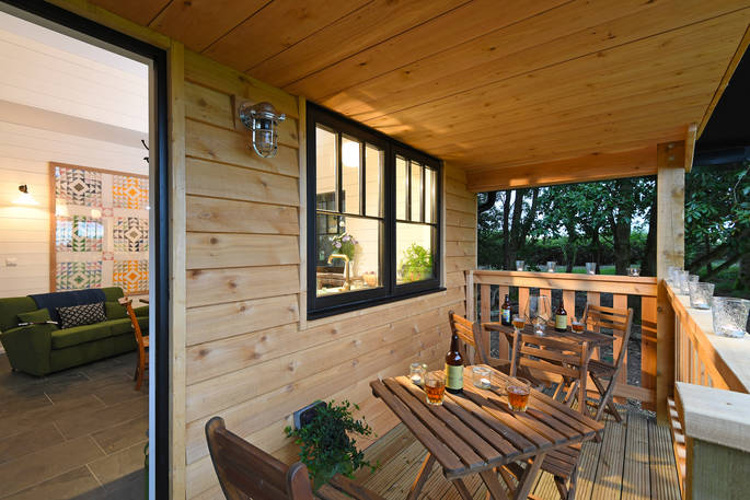 Sit outside and relax with a beer at Walden Lodge at Hide at St Donats 