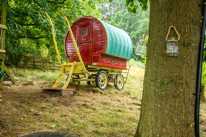 Rustic gypsy caravan next to the treehouse at Copse Camp in Denbighshire 