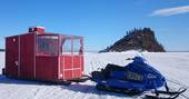lake_inari_snowmobile_cabin
