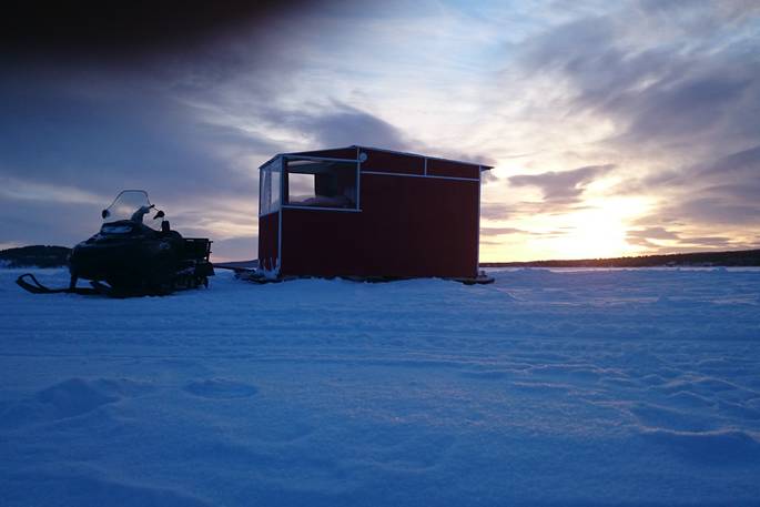 lake_inari_snowmobile_cabin