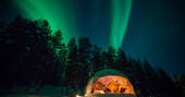 Northern Lights in the skies above Aurora Dome in Finnish Lapland